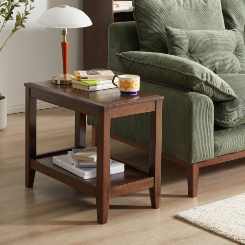 Walnut-finish solid rubberwood side table with lower shelf beside an olive green armchair